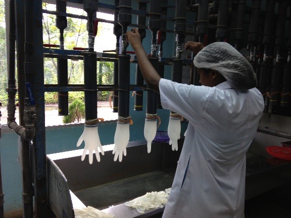 Women making rubber gloves in Sri Lanka